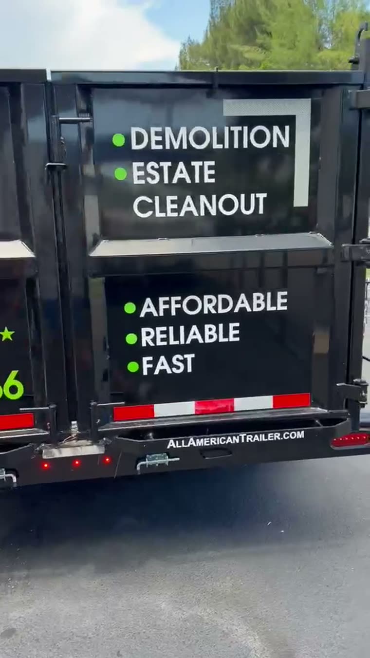 Rear of the ML Junk Removal trailer showing demolition and estate cleanout services